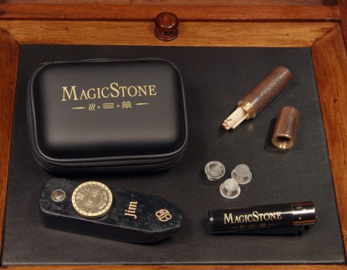 MagicStone Odyssey Elemental Kit packed with Odyssey heat-don't-burn cannabis device and essential accessories. Pick/stash tube, extra basket screens and custom Clipper lighter