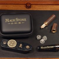 MagicStone Odyssey Elemental Kit packed with Odyssey heat-don't-burn cannabis device and essential accessories. Pick/stash tube, extra basket screens and custom Clipper lighter