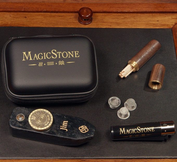 MagicStone Odyssey Elemental Kit packed with Odyssey heat-don't-burn cannabis device and essential accessories. Pick/stash tube, extra basket screens and custom Clipper lighter