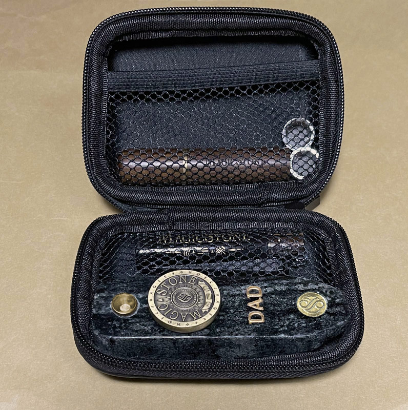 MagicStone Odyssey II Elemental Kit packed with Odyssey II heat-don't-burn cannabis device and essential accessories. Pick/stash case, extra basket screens and custom lighter
