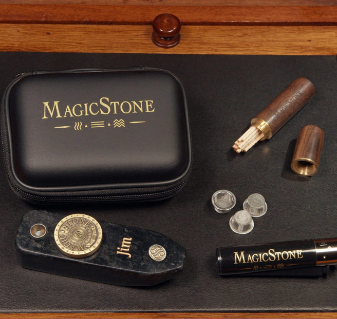 MagicStone Odyssey II Elemental Kit packed with Odyssey II heat-don't-burn cannabis device and essential accessories. Pick/stash case, extra basket screens and custom lighter
